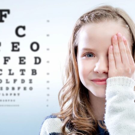 qtq80-XlMdgY Child doing an eye exam